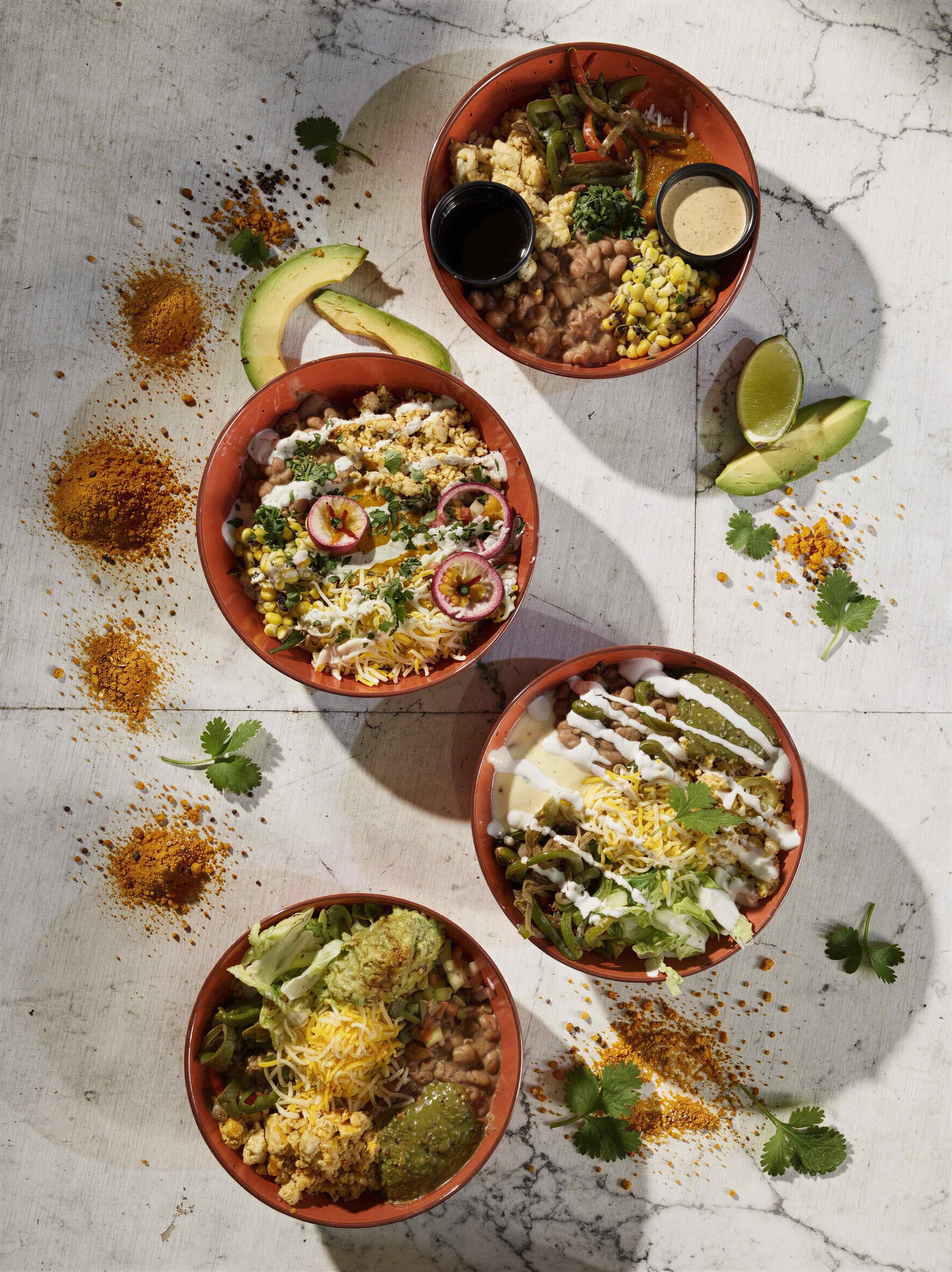 Four colorful fusion bowls